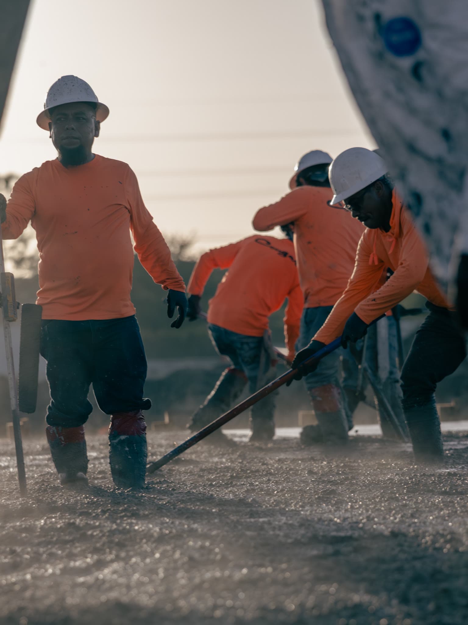 Concrete crew screeding a fresh slab pour at the Foley Products facility in Fort Myers